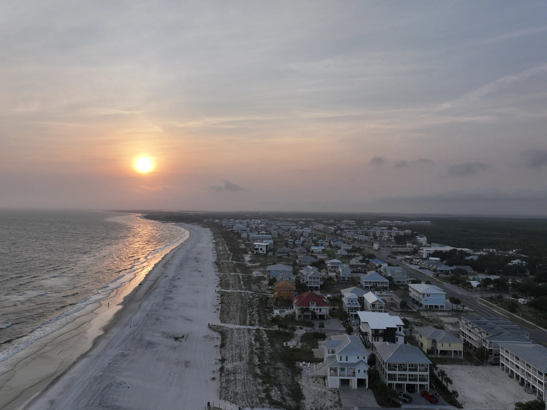 Sunset drone photo of the Mexico Beach FL coastline, beach houses and the Gulf, shot July 28 2026 by JandyLucho