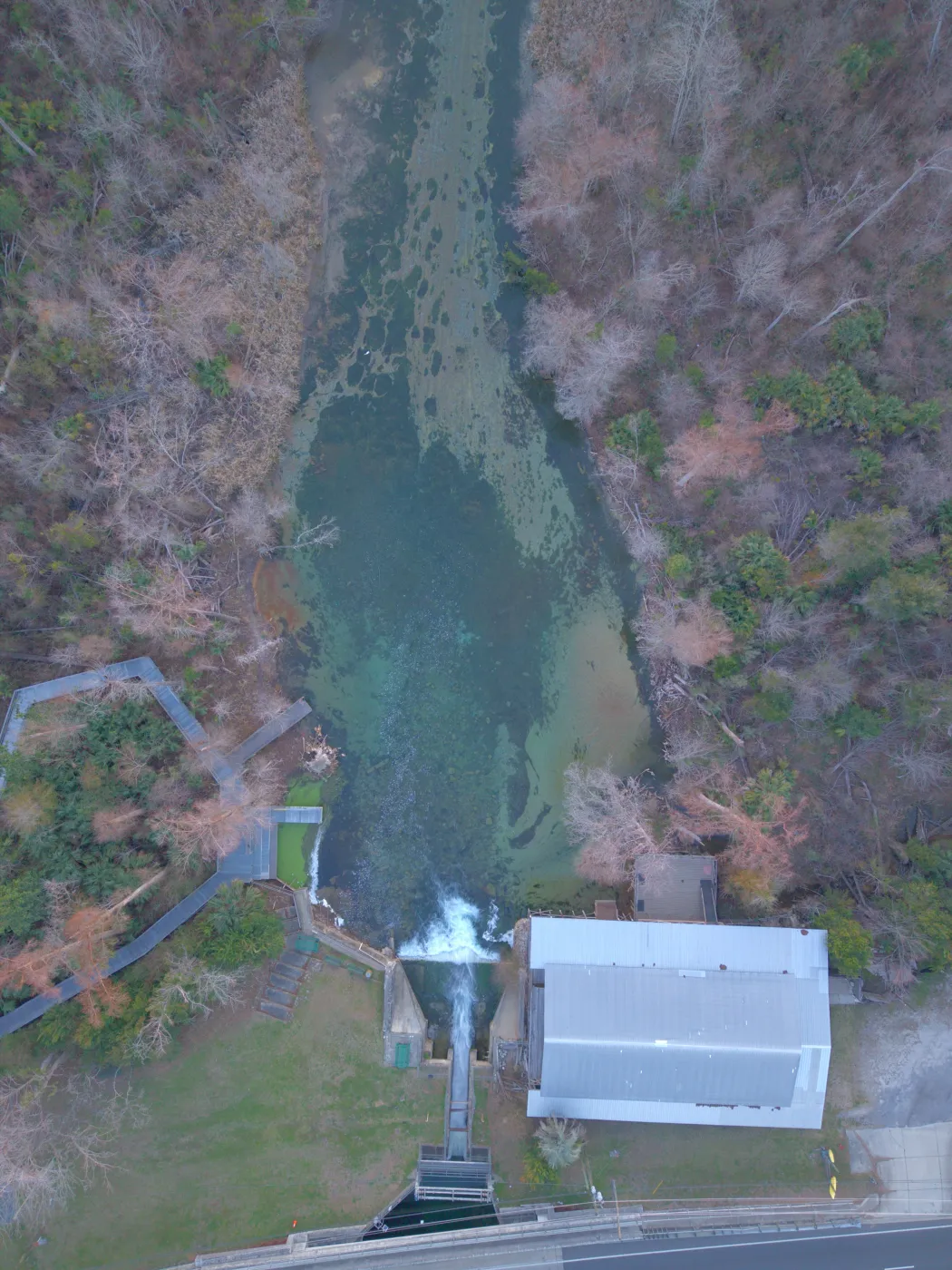 Aerial drone view straight down over the spring, dam and historic grist mill at Merritt's Mill Pond in Marianna, Florida, by JandyLucho Marketing and Media