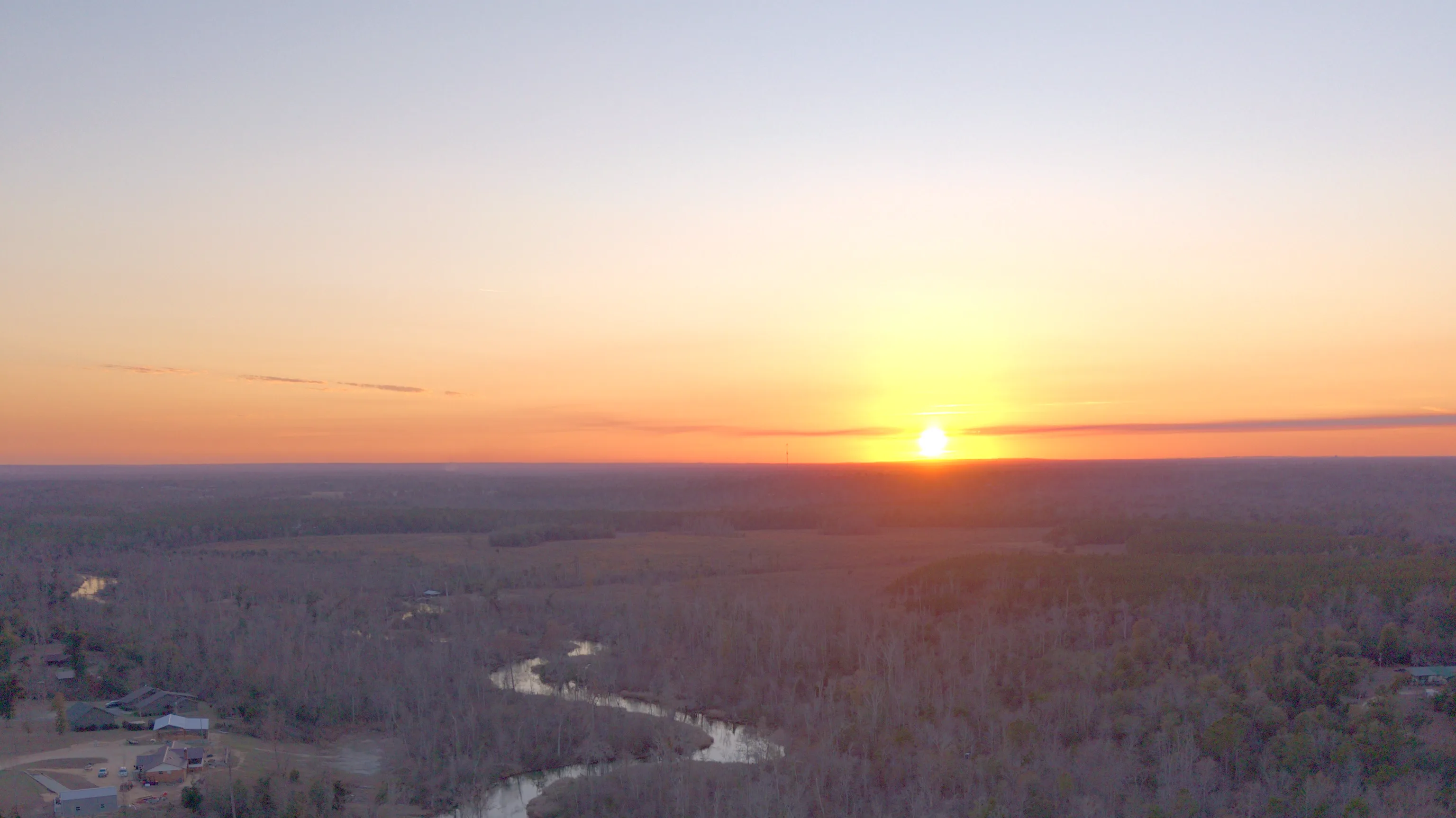 Aerial drone photo of sunset over Merritt's Mill Pond and the Marianna countryside by JandyLucho Marketing and Media