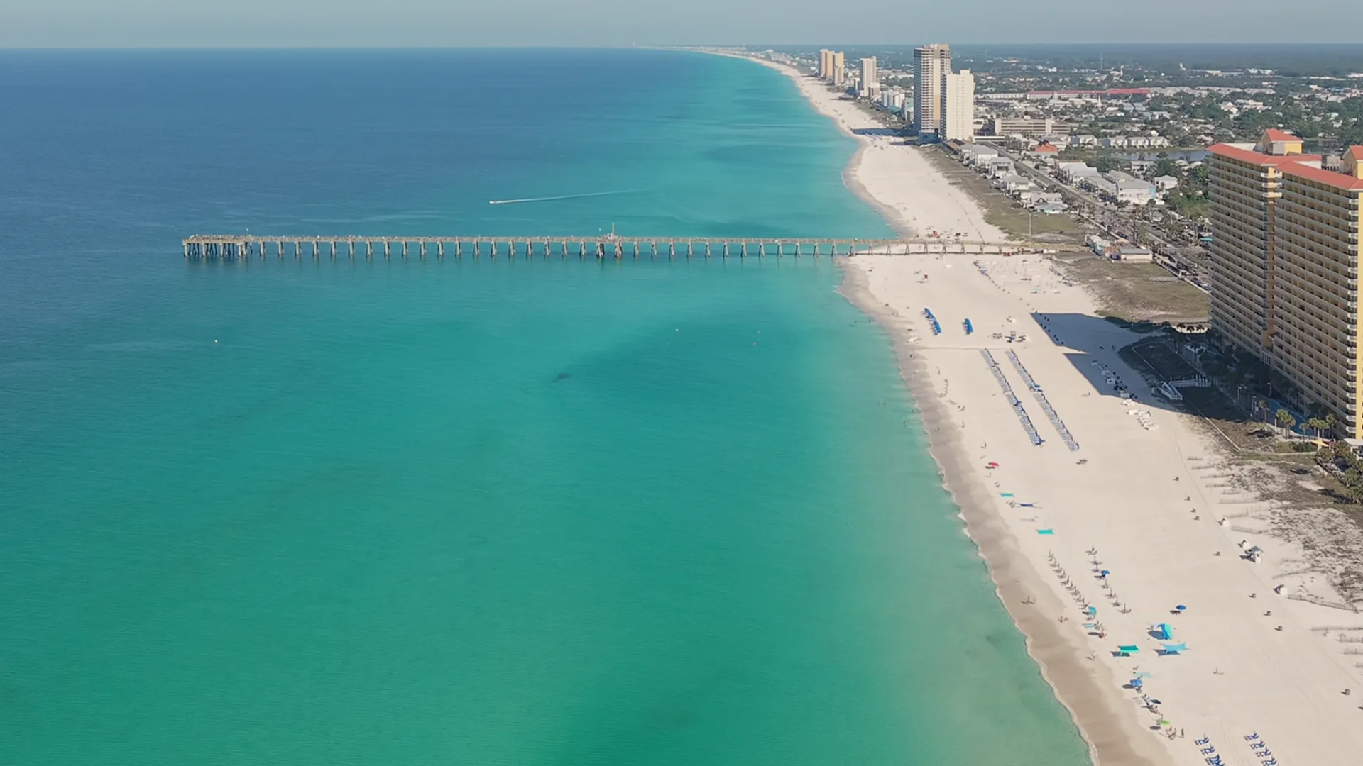 Aerial drone view of Panama City Beach — the pier, emerald Gulf water and white sand — by JandyLucho Marketing and Media